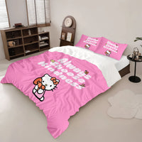 A close-up of a pink polka dot Hello Kitty bedding set featuring Always Choose Kindness text and character with hearts on a white bed.