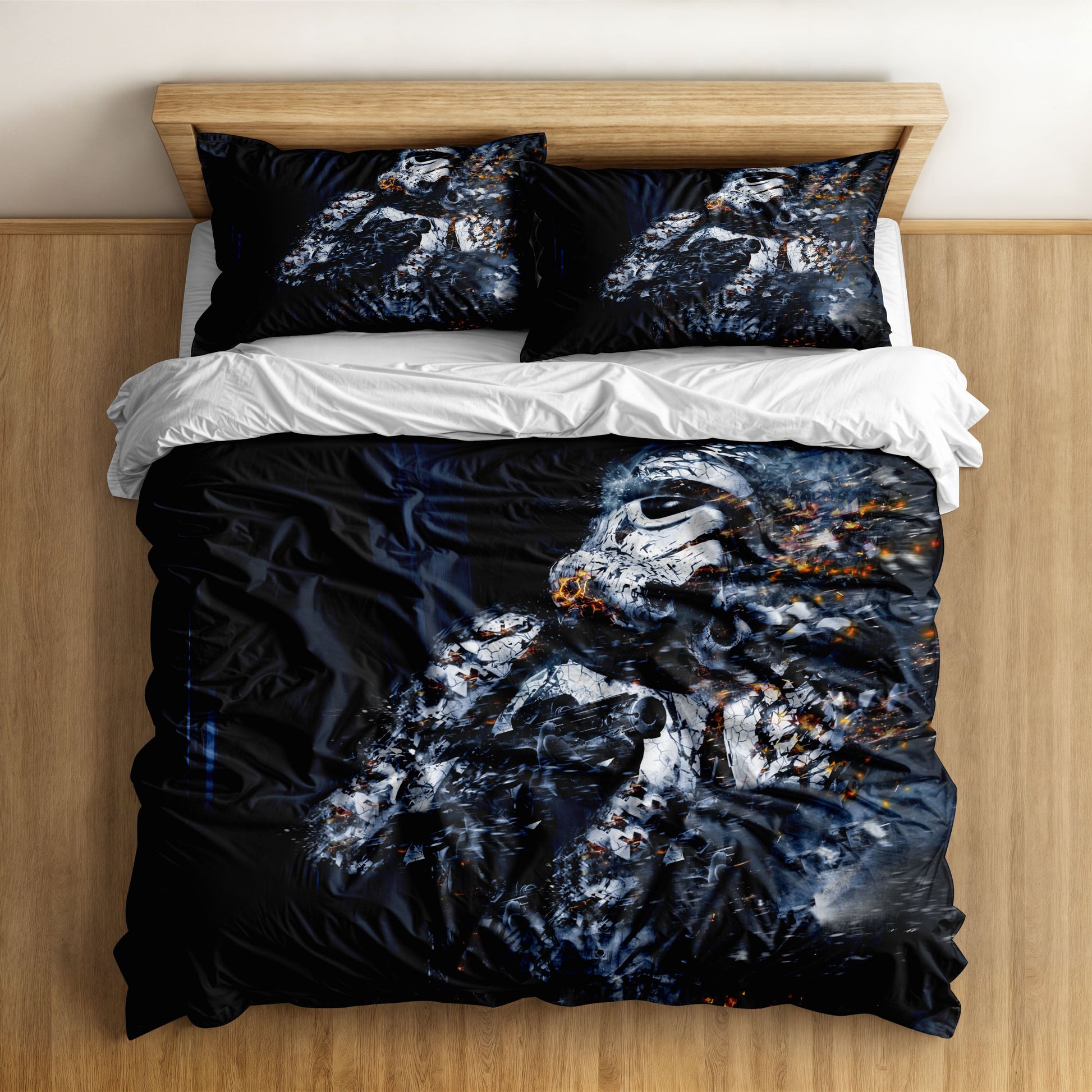 An abstract, artistic depiction of a Stormtrooper helmet dissolving on a black duvet cover.
