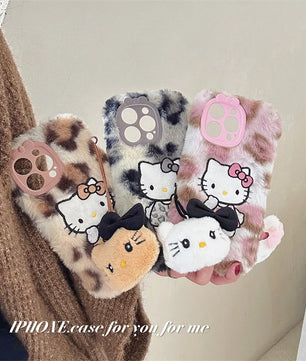 Lusy Store Luxury winter fluffy hand warmer Plush Leopard Hello Kitty phone case for iPhone 16 15 14 13Pro Max Cartoon KT Furry Wrist Strap 