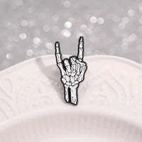 Halloween Skeletal Hand Enamel Pins Custom Rock and Roll Gesture Brooches Lapel Badges Punk Gothic Jewelry Gift for Kids Friends