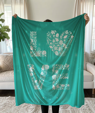 Teal bedding set with white LOVE design and floral patterns for Valentine's Day duvet cover