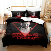 Bedding set with 'Stranger Things' design featuring a young boy in a triangle, in a bedroom setting.